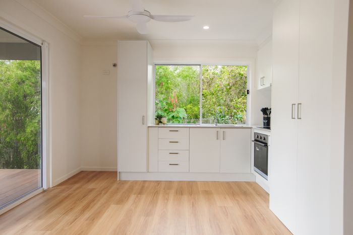Bright open-plan granny flat kitchen and living area